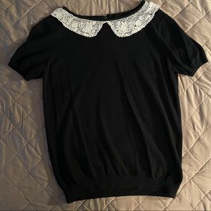 Cute black top, with frill trim